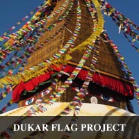 photo of famous Stupa in Bhoda Nath Nepal decorated with Drigung Kagyu prayer flags to promote loving kindness and the Dharma