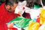 The vast majority of our Dugkar Prayer Flags were darding.  Here, Togden Yunga Rinpoche is reading the prayer before blessing them.