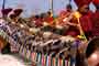 Monks playing Buddhist horns in procession during opeing ceremonies