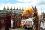 At Drubgyügön Monastery, monks dressed up as Ekajati, Rahula, and Damchan - the three protectors of Nyingmapa and Achi, Mahakala and Dharmapala Tsiumarpo - the three protectors  of Drigung Kagyu come and receive His Holiness, who was in the brocade-draped car.
