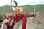 A long line of monks follow the Nyingmapa and Drigung Kagyu dharmapalas to receive His Holiness.