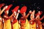 The Drigung monks saying auspicious Prayers and throwing flower petals in the air.
