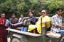 After our travel in Loga Rinpoche's car, we jumped in a tractor.  See Genyen Jamyangling and Loga Rinpoche seated on a specially fitted sofa!