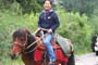 Genyen Jamyangling on horseback